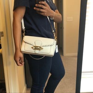 Off white colored Coach Handbag